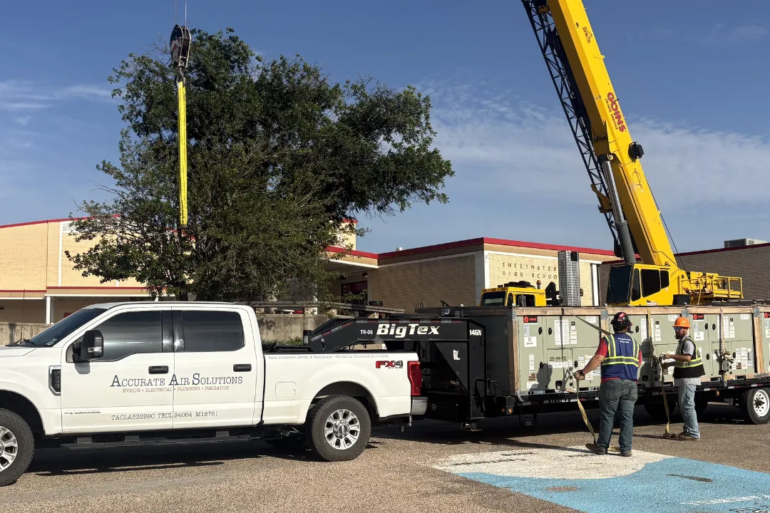 Two cranes working an Accurate Air Solutions commercial job site