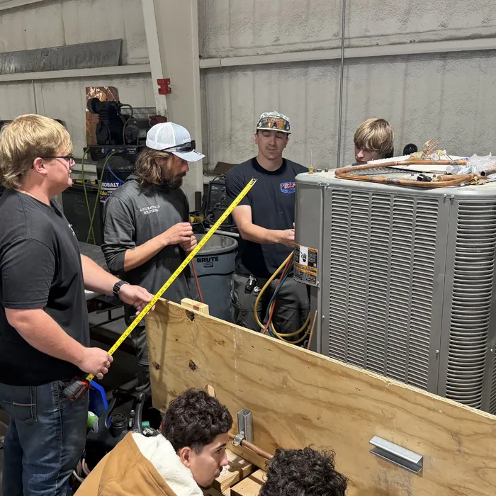 Crew laying out work on the fabrication floor